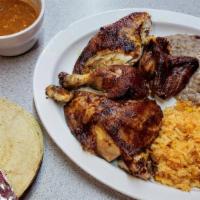 Half Chicken Combo · Four pieces of our slow cooked rotisserie chicken with rice, refried beans, tortillas, and h...