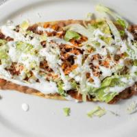 One Huarache · A popular mexican dish consisting of a masa dough base smashed with pinto beans, your choice...