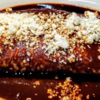 Burrito Poblano · Choose chicken or steak inside with rice, beans, and cheese. Topped with Mole sauce and crum...