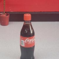 Coke Half Liter · Half liter Coca Cola in a glass bottle.
