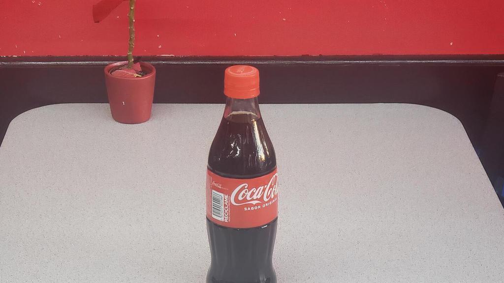 Coke Half Liter · Half liter Coca Cola in a glass bottle.