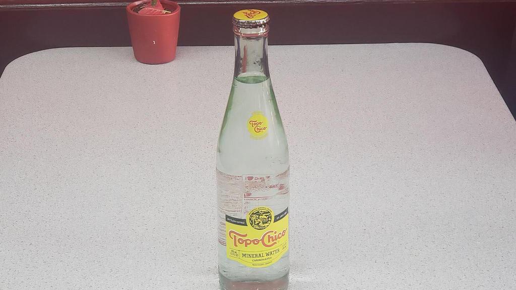 Topo Chico · Mineral water in a glass bottle.  (requires bottle opener)