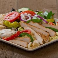 Chicken Santorini · marinated grilled chicken with grilled peppers and onions, served on a bed of rice pilaf, pi...