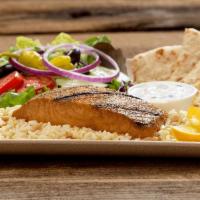Grilled Salmon · Norwegian sustainable salmon, served on a bed of rice pilaf, with pita, tzatziki pita sauce ...