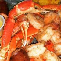Colossal Plate · Two Cajun style crab leg clusters, 12 boiled shrimp, two corn on the cob, two boiled potatoe...