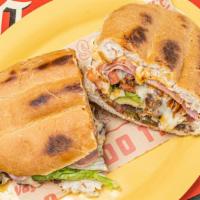 Torta Cubana · ALL Tortas served on Mexican “Telera”bread, refried beans, chipotle mayo, cheese, lettuce, a...