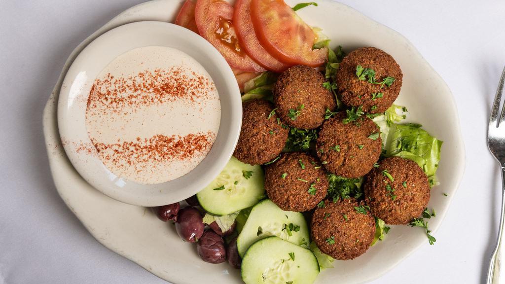 Falafel · Lebanese vegetable patties, mixture of cracked wheat and chick peas, deep fried.