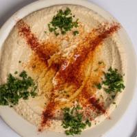Hummus · click peas blended with tahini (sesame paste(, lemon juice and garlic