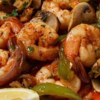 Shrimp Scampi  · Shrimp sautéed in butter, garlic and lemon juice topped with mushrooms and bell pepper