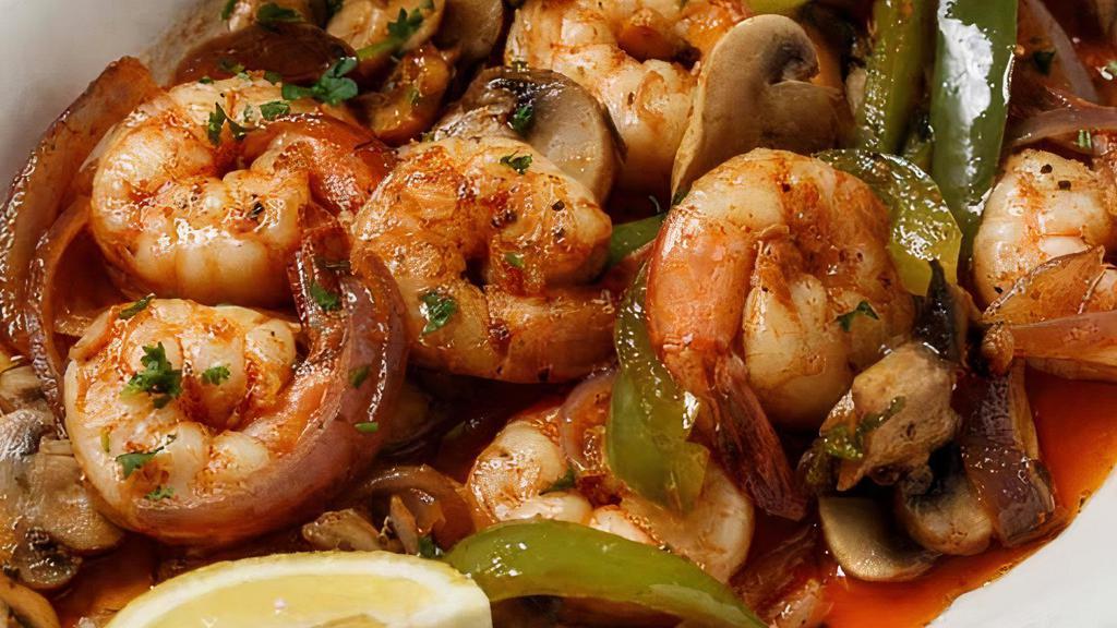 Shrimp Scampi  · Shrimp sautéed in butter, garlic and lemon juice topped with mushrooms and bell pepper