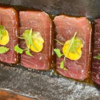 Tuna Usuzukuri · Spicy. Bluefin tuna, truffle oil, spicy mayo, kizami wasabi, ponzu, micro cilantro.