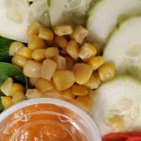House Salad · Vegan, vegetarian. Mixed greens, cucumber and corn with ginger dressing.