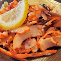 Ika Sansai · Thinly sliced squid salad mixed with mountain vegetables.