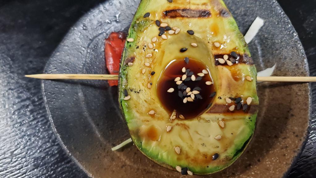 Yakitori Half Avocado · Vegan, vegetarian. Grilled half avocado, with Japanese sweet soy and sesame seeds.