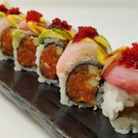 Ume · Spicy tuna, tempura crunchies and cucumber, topped with hamachi, avocado and red tobiko, man...