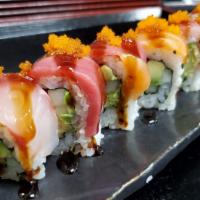 Rainbow Roll · Crab stick, avocado, cucumber; topped with fresh sashimi, eel sauce