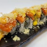 Kage · Tempura shrimps, cucumber inside, spicy salmon, tempura crunches, spicy mayo and mango sauce...