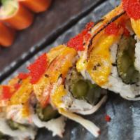 Kani Island · Asparagus, cucumber, avocado, tempura crunches; topped with kani crab, torched spicy mayo, r...