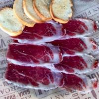 Paleta Iberica · Acorn-fed 1% Iberico Ham. Served with crostini
