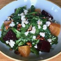 Spinach Salad · Baby spinach, golden and red beets, caramelized walnuts, arugula, goat cheese, basil ginger ...