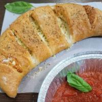 Build Your Calzone · Create your own calzone with up to four toppings, our calzone Stuffed with a plentiful amoun...