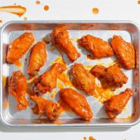 10 Buffalo Chicken Wings · Tossed with your choice of sauce and served with a side of ranch or blue cheese dressing.