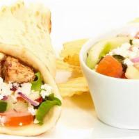 Greek Salad Gyro · Tomatoes, cucumbers, roasted red peppers, red onions, mixed lettuce, feta, and Greek dressing.