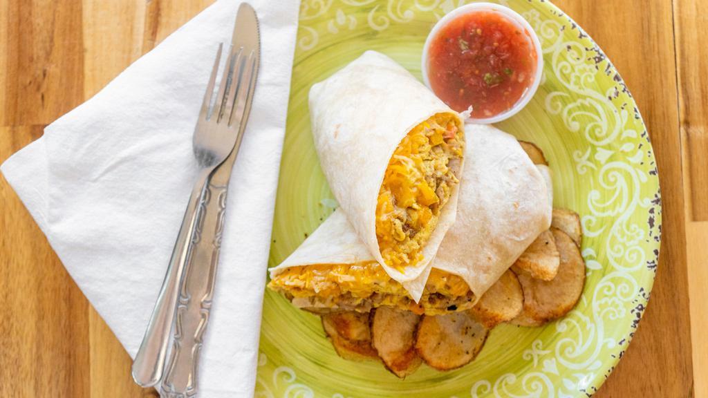 Humongo A.M. Burrito · Scrambled eggs, sausage peppers, onions, and cheese, in a flour tortilla wrap, served with salsa and sour cream. Served with Crave taters.