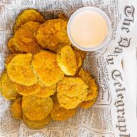 Fried Pickle Chips · Gluten-free flash fried pickled chips served with signature Crave sauce.