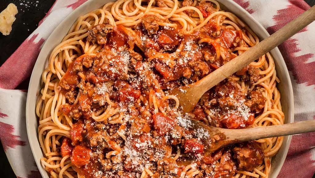 Spaghetti With Meat Sauce · Cooked ground beef cooked with our delicious homemade marinara sauce baked with spaghetti noodles topped with grated parmesan cheese.