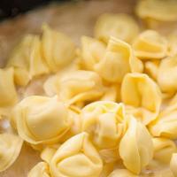 Meat Tortellini · Ring-shaped pasta stuffed with meat and cheese. Baked with marinara and topped with mozzarel...