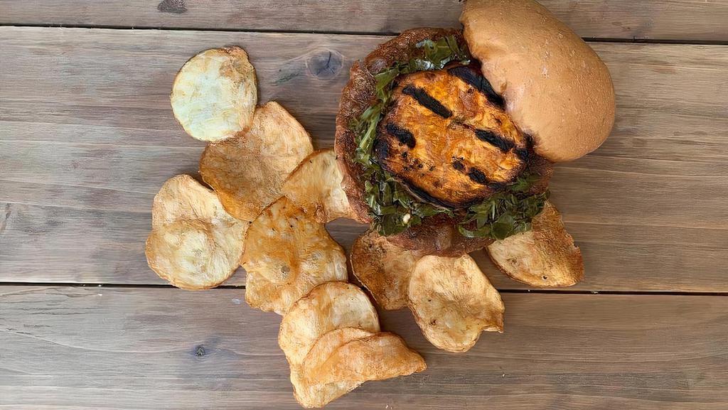 Black Eye Pea Burger · Black Eyed Pea patty topped with a oven roasted sweet potato slice, pickled collard greens, and sriracha aioli on a lightly toasted wheat bun.