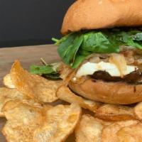 Magic Mushroom · Portabella mushroom cap topped with melted goat cheese, fresh spinach, sautéed onions, and d...
