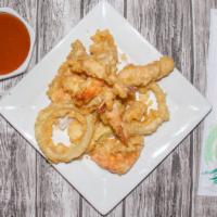 Shrimp Tempura · 4pcs Lightly battered fried Shrimp, 1pc zucchini,1pc sweet potato and 1pc onion ring.