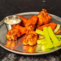 Chicken Wings · Baked, celery and ranch or blue cheese dressing.