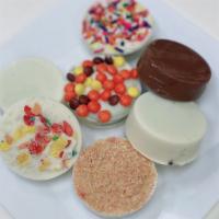 Chocolate Covered Oreos (2 Pcs) · America's favorite cookie dipped in our milk or white chocolate.