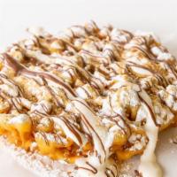 S’Mores Funnel Cake · Your favorite fair food with a sprinkle of powdered sugar. This funnel cake is topped with m...