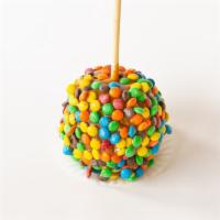 M&M Apple · A classic granny smith apple dipped in caramel sauce, rolled in M&M pieces