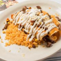 Enchiladas El Jefe Lunch · Two corn tortillas stuffed with carne azada, grilled corn and onions. covered with queso fre...