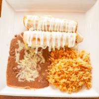 Chimichanga Dinner · Two flour tortillas filled with your choice of shredded beef or chicken, topped with cheese ...