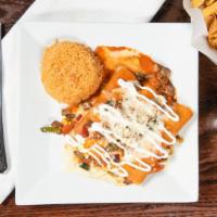 Enchiladas El Jefe · Three enchiladas stuffed with carne asada, grilled corn and onions, covered with queso fresc...