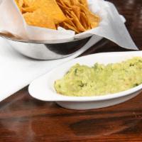 Fresh Table Side Guacamole · Freshly made table side guacamole with avocados, jalapeno, tomato, onion, lime, salt and cil...