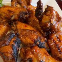 Gosport Wings · Fried crispy, finished on the grill, celery, blue cheese, choice of buffalo, Thai chili or p...