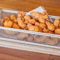 Fried Crawfish Tails · Lightly dusted, fried crisp and served with remoulade sauce