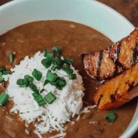 Bowl Red Beans · Red beans simmered in our rich creole broth, rice and garnished with andouille sausage.  The...
