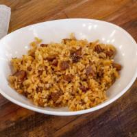 Dirty Rice · Long grain rice sauteed with trinity, cajun seasonings and andouille sausage.