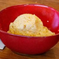 Grits · A side of our stone ground white cheddar grits