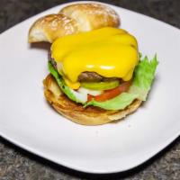 Exquisites House Made Burger W/Fries  · Dressed w/ lettuce, tomato, onion, pickles cheese served on a brioche bun