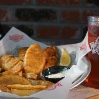 Fish & Chips · Beer Battered & Served with Wedge Cut Fries & Tarter Sauce.
