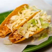 Tacos · Choice of chicken or beef, topped with lettuce and shredded cheese